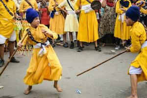 Delhi, India, October 2, 2023 - Sikhs display gatka and martial arts during annual Nagar Kirtan, Traditional, procession on account of birthday of Guru Nanak Dev ji, Nagar Kirtan in East Delhi area photo