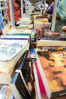 New Delhi, India, September 09 2023 - Variety of Books on shelf inside a book-stall at Delhi International Book Fair, Selection of books on display in Annual Book Fair. photo