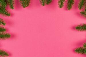 Top view of colorful festive background made of fir tree branch. Christmas holiday concept with copy space photo