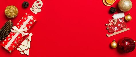 Top view of Banner Christmas decorations on red background. New Year holiday concept with copy space photo