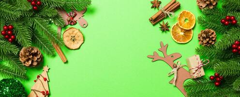 Top view Banner of Christmas decorations on green background. New Year holiday concept with copy space photo