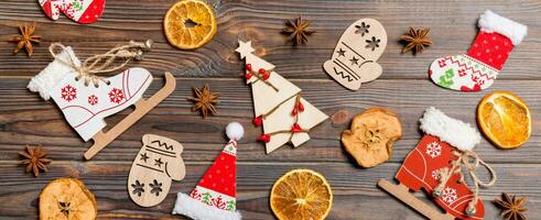 Top view of Banner Christmas toys on wooden background. New Year ornament. Holiday concept photo