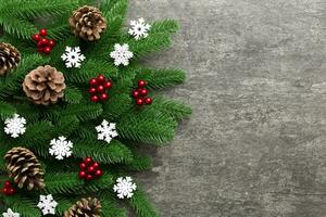 Christmas background with fir branches and Christmas decor. Top view, copy space for text photo