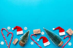 Flat lay composition with christmas trees on color background. Top view with copy space photo