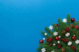 Christmas background with fir branches and Christmas decor. Top view, copy space for text photo