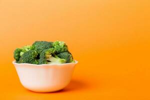 broccoli of fresh green broccoli in bowl over coloredbackground. , close up. Fresh vegetable photo