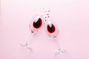 Many glasses of red wine at wine tasting. Concept of red wine on colored background. Top view, flat lay design photo