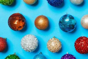 Top view of colorful Christmas balls on blue background. New Year time concept photo