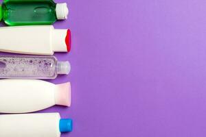 Top view of cosmetics bottles on colored background. Skin care concept with space for your design photo