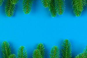 Top view of colorful festive background made of fir tree branch. Christmas holiday concept with copy space photo