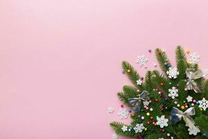 Christmas background with fir branches and Christmas decor. Top view, copy space for text photo