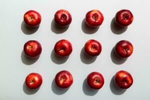 Many red apples on colored background, top view. Autumn pattern with fresh apple above view photo