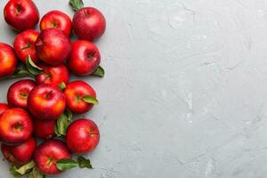 Many red apples on colored background, top view. Autumn pattern with fresh apple above view with copy space for design or text photo