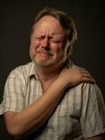 Man with pain on neutral background AI Generative photo