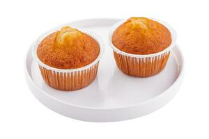 homemade muffins or cupcakes isolated on white background photo