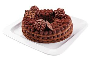 Tiramisu pastel con chocolate decoración en un plato foto