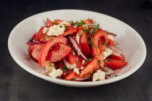 Salad with Goat Cheese, dill, Tomato and Red Onion Rings photo