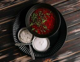 Ukrainian cuisine - borscht with sour cream photo