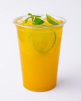 Alcohol cocktails with orange juice and lime slices photo