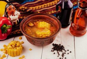 Mexican corn soup with pepper close up photo