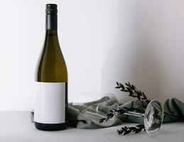 Bottle of white wine with glass photo