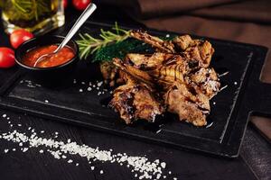 BBQ Grilled lamb chops steaks on board photo