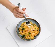 Italian spaghetti on fork close up photo