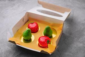 fruit-shaped mousse cakes in a box photo