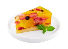 Jelly cake with fruit on white plate photo