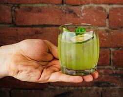 Fresh summer green basil cocktail in a glass photo