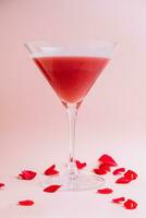 Strawberry alcohol cocktail in martini glass photo