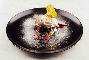 Chocolate fondant with ice cream balls photo