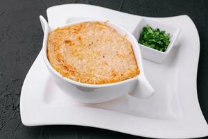 French onion soup with cheese in bowl photo