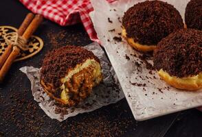 Chocolate doughnut with gooey filling inside photo