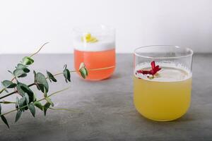 Fresh pineapple juice and chamomile syrup with lemon photo