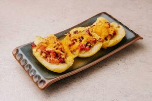 Baked stuffed bell peppers filled with bacon photo