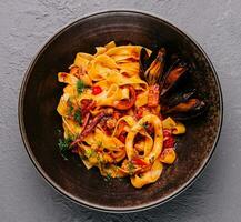 pasta with mussels, squid and octopus photo