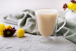 Almond milk latte in a glass photo
