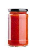 Tomato paste in a glass jar on a white background photo