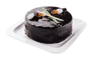 Tasty chocolate cake with prunes and nuts photo