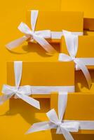 Yellow gifts on a yellow background photo