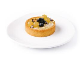 Lemon tartlet with blueberries and grapes photo