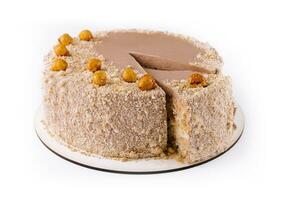 Kiev cake with hazelnut on white plate top view photo