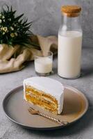 Delicious cake with whipped cream and caramel filling photo