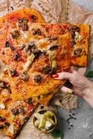 pizza with minced meat, artichokes and mushrooms photo