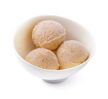 Three balls of vanilla-banana ice cream in white bowl photo