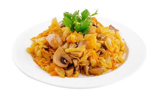 Fried cabbage with mushrooms on white plate photo