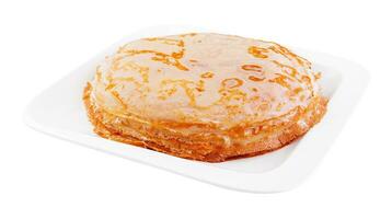 Tasty thin pancake on white plate photo