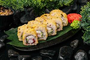 Warm sushi rolls with tempura shrimp photo