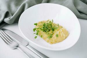 Bowl with tasty mashed potatoes on top view photo